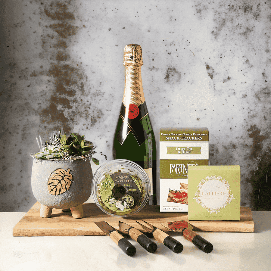 A Special Celebration Gift Basket Sparkling Wine, Brass Charcuterie Knife Set, Tripod Succulent Planter Arrangement, Cheese, Crackers, Chocolate Truffles and Board.   