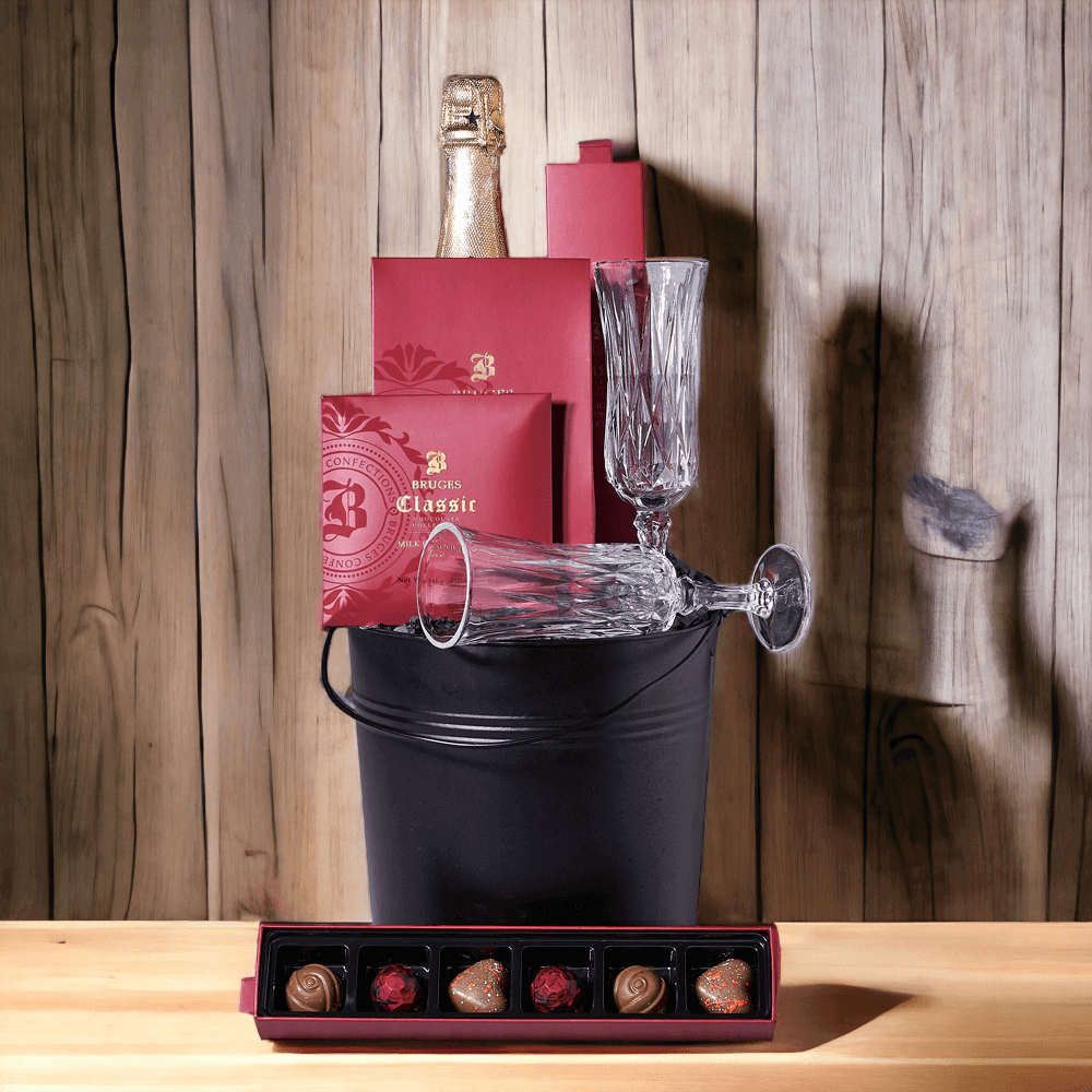 For a special celebration "Champagne & Chocolate Gift Bucket" features: chocolate covered coffee beans, chocolate truffles, a milk chocolate bar, two champagne glasses, and a bottle of sparkling wine.