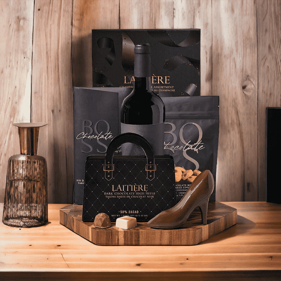 Chocolates charm everyone! Chocolate & Wine Gift Set features: Wine, Chocolate, Cookies, & Hexagonal Acacia End Grain cutting Board.