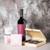 The Sumptuous Relaxation Wine Gift Set is a curated collection of fantastic gifts featuring a bottle of wine, a complete set of wine tools in a wooden box, a fragrant rosewater candle, and a box of gourmet chocolate truffles.