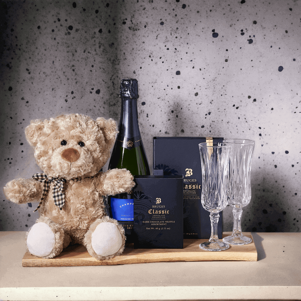 Do the truffle shuffle with this amazing gift basket! Featuring delicious chocolate truffles, chocolate bars, two champagne flutes, a charming bear plush, and a cutting board, this gift is perfect for the chocolate-lover in your life.