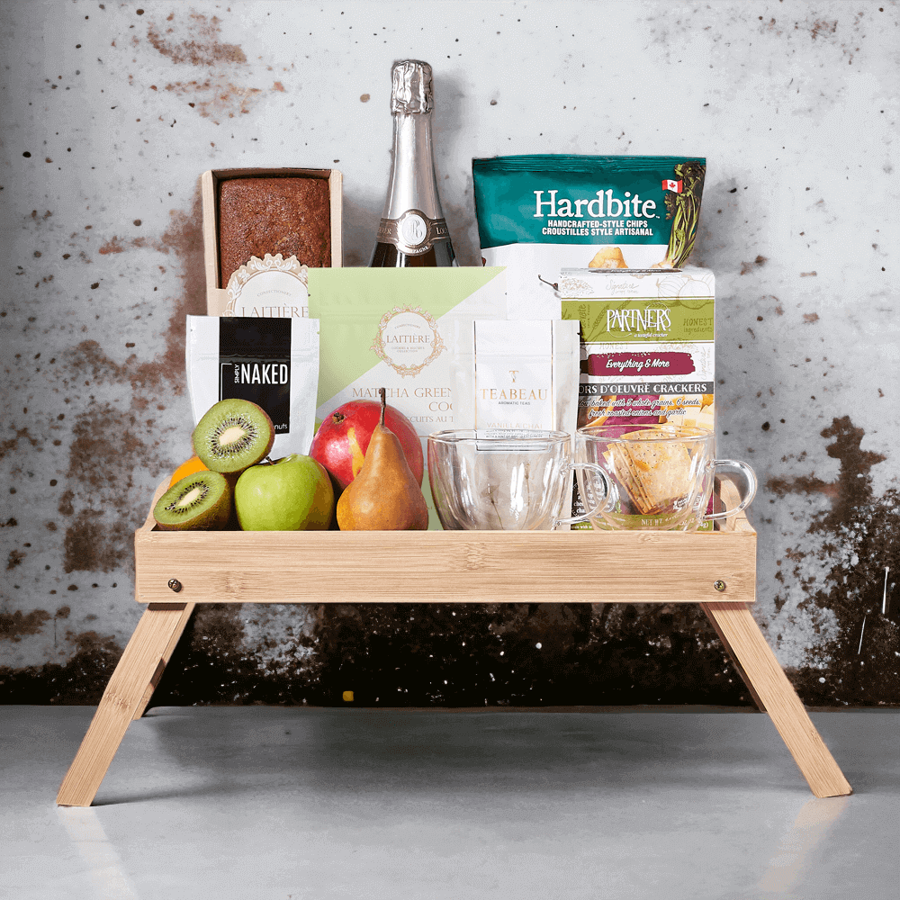 This delicious gift has a selection of fresh fruit, dry roasted pistachios, parsnip chipotle raspberry chips, matcha green tea cookies, vanilla chai, everything & more crackers, banana bread, and a bottle of sparkling wine.