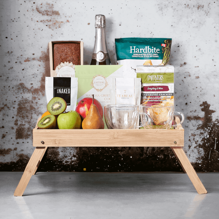 This delicious gift has a selection of fresh fruit, dry roasted pistachios, parsnip chipotle raspberry chips, matcha green tea cookies, vanilla chai, everything & more crackers, banana bread, and a bottle of sparkling wine.