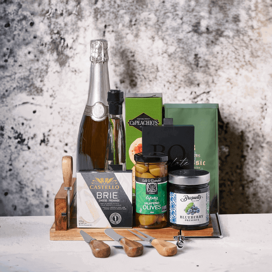 Sparkling Wine & Snacks Gift Board! This elegant gift is complete with a bottle of sparkling wine, creamy brie cheese, crackers, tipsy jalapeno olives, coffee, chocolate truffles, blueberry preserves, extra virgin olive oil, and a lovely wood serving board with cheese knives. 