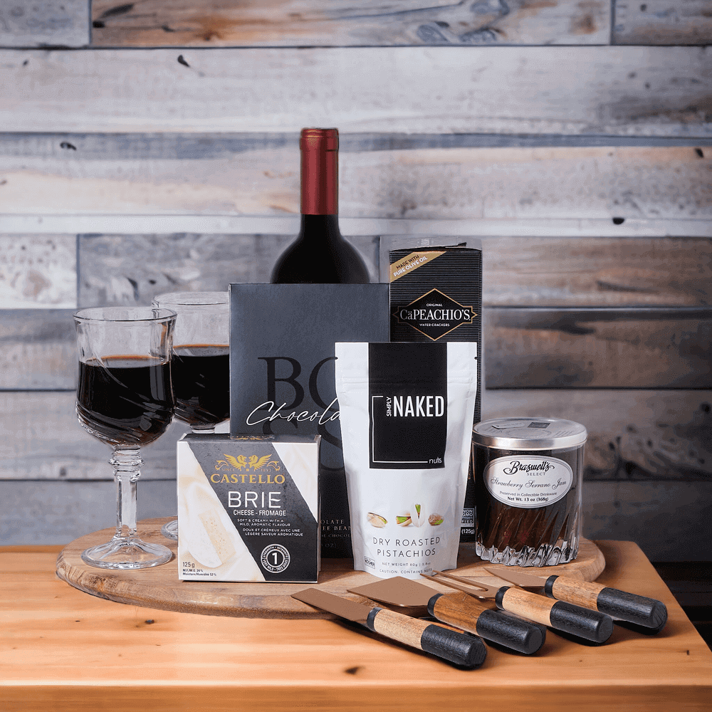 The set features silky and decadent dark chocolate covered coffee beans, a bottle of wine, dry roasted pistachios, tangy strawberry serrano jam, creamy brie cheese,