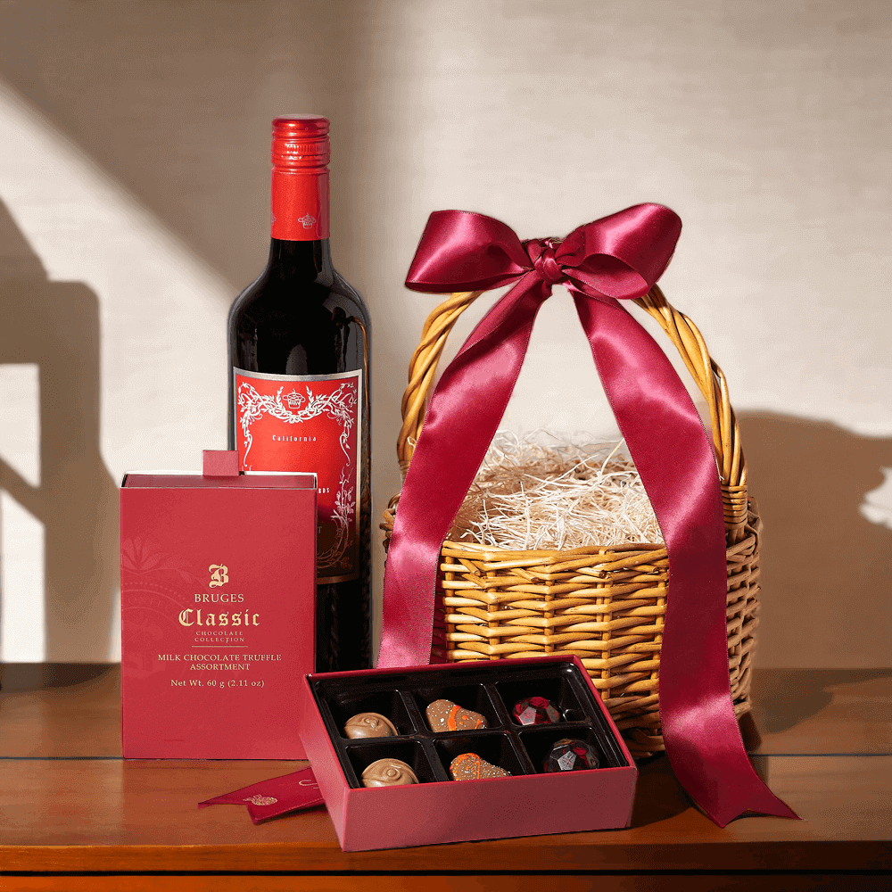 This gift basket includes a bottle of wine, a box of gourmet chocolate truffles, and a charming wicker gift basket.