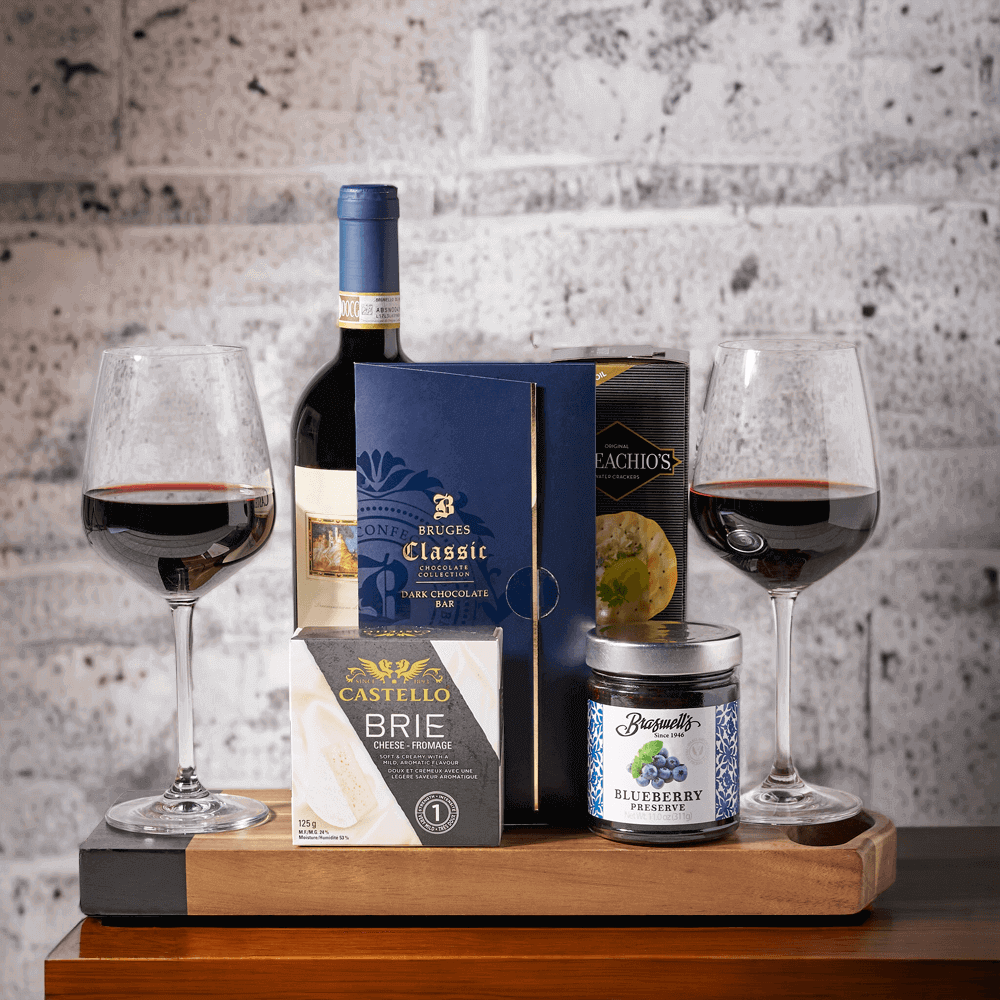 The Romantic Wine & Cheese Gift Set is wonderful. Included in this delicious and thoughtful gift is a bottle of wine, creamy brie cheese, a bar of gourmet dark chocolate, savoury crackers, and blueberry preserves.