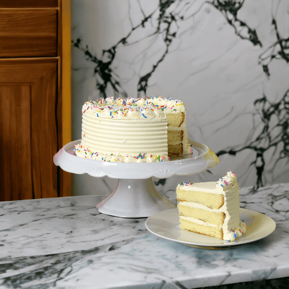 The perfect cake to celebrate their special day, The Vanilla Birthday Cake. This vanilla cake features vanilla frosting and finished with vanilla buttercream; decorated for birthdays and other special occasions. This cake measures 6 inches in diameter.