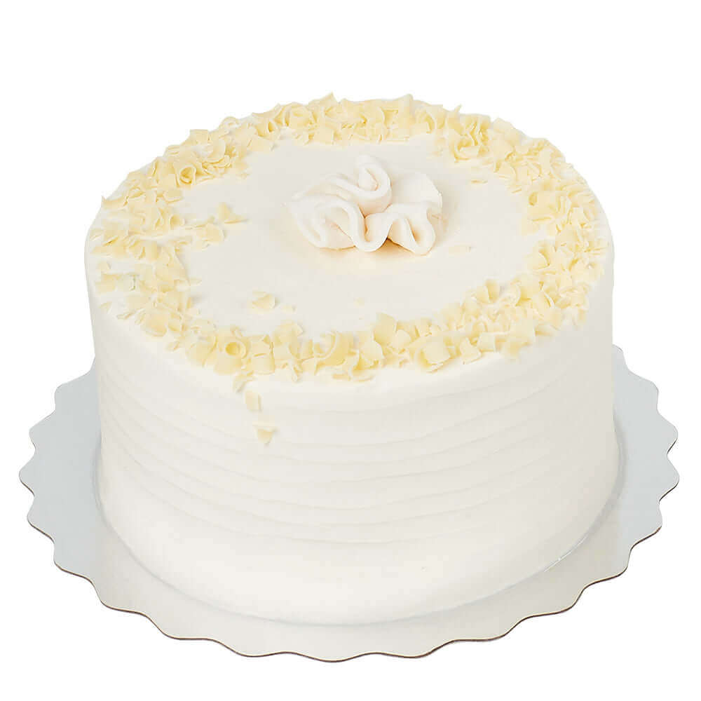 The Vanilla Layer Cake features 3 layers of buttery vanilla cake frosted with luscious vanilla buttercream between each layer of cake.