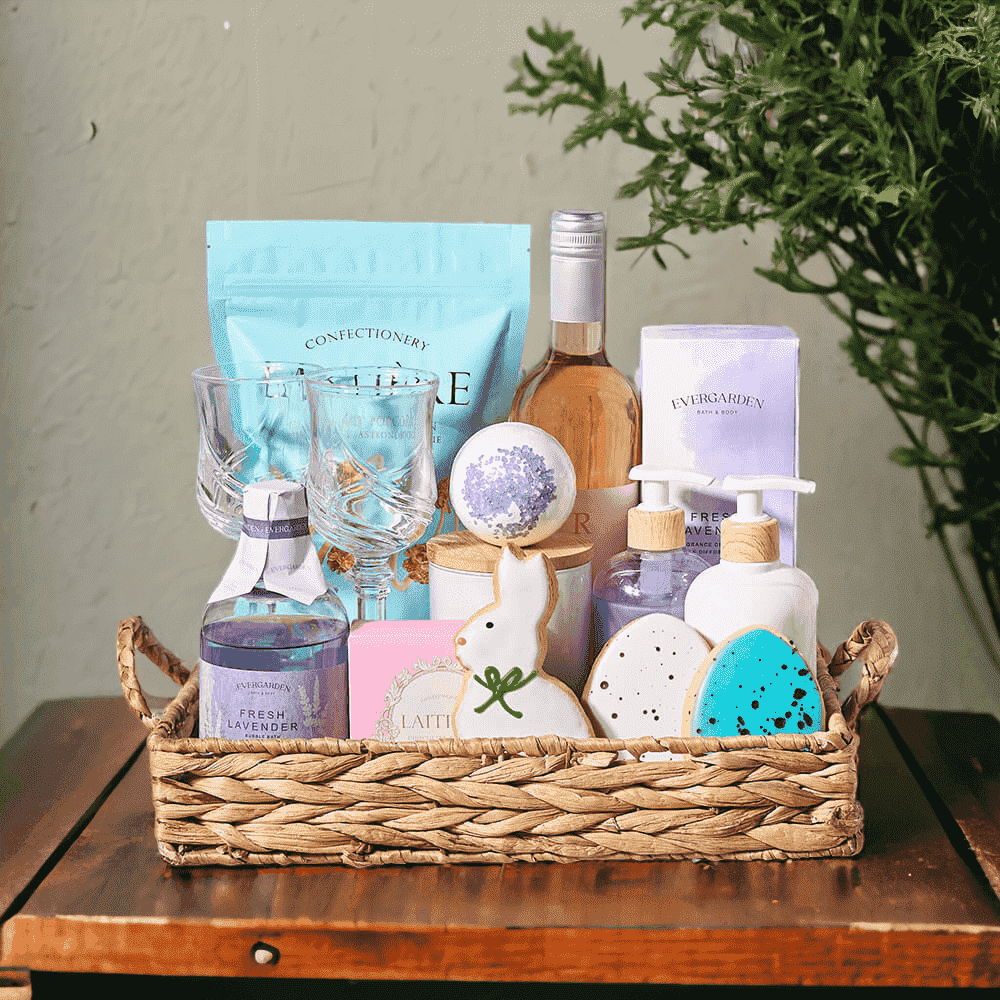 "Wine & Relaxation" Easter Gift Basket Bottle of Wine, Bubble Bath, Candle, Bath Bomb, Hand Soap, Hand Cream, Diffuser, 2 Small Easter Egg Sugar Cookie (Easter), Popcorn, Chocolate, Glasses, and Tray.